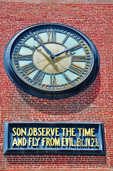 San Francisco: the clock of the Old Cathedral of Saint Mary and the admonitory phrase beneath it