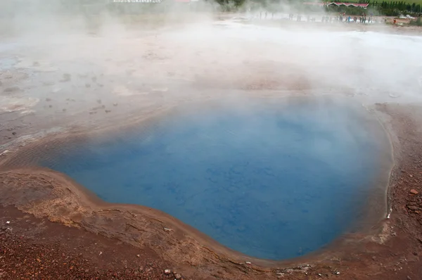 Iceland: a boiling water source in the Geysir area