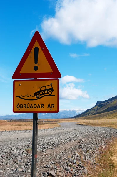 Iceland: a road sign warning for water on the off road vehicle trail in the Icelandic landscape