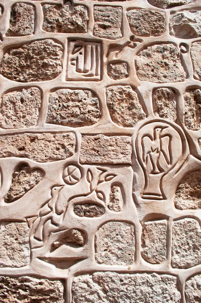 Jerusalem: marks and symbols on a wall at the entrance of the Armenian Quarter