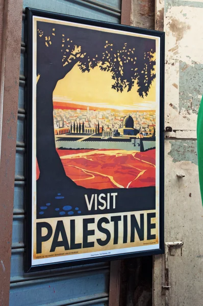 Jerusalem, Israel: a poster hanging in a shop inviting to visit Palestine