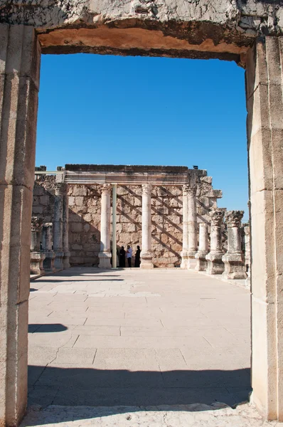 Israel: the entrance door at the ruins of Capernaum Synagogue