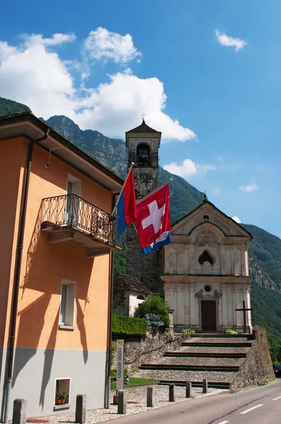 Switzerland: view of the Church of Saint Mary of the Angels and a Swiss flag