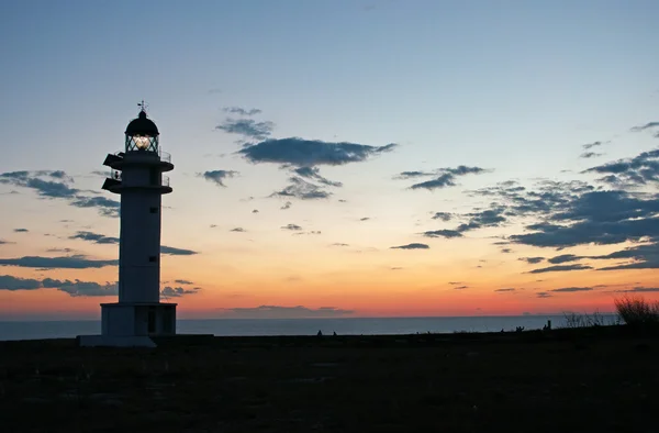Fomentera: Cap de Barbaria Lighthouse with the light on at sunset