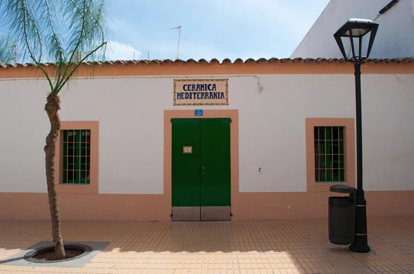 Formentera: the green door of Ceramica Mediterranea, a ceramic craft store in Sant Francesc Xavier