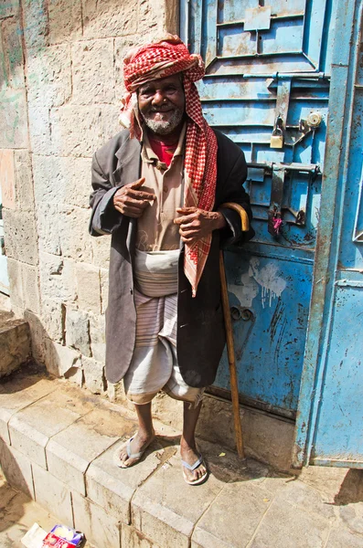 A yemeni man smiles in the jewish quarter of the Old City of Sana\'a, turban, Yemen