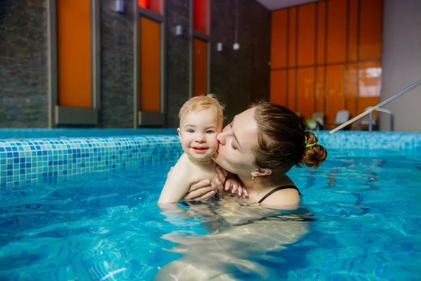 Mother with child in pool