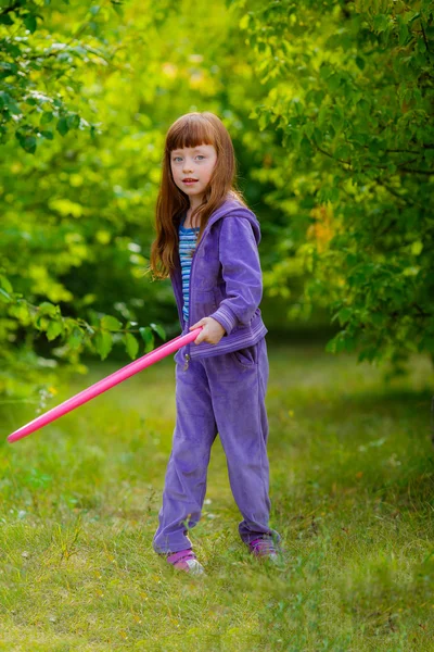 Little girl with hula hoop