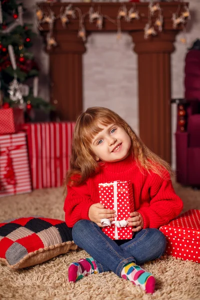 Little girl with New Year presents
