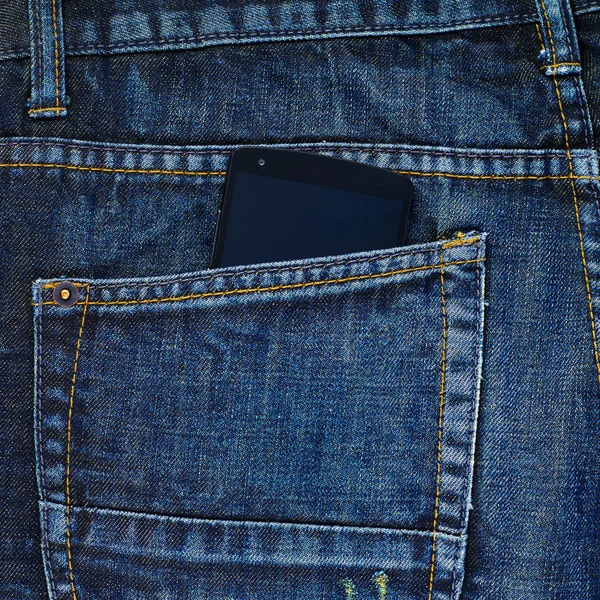 Smart phone in pocket of jeans