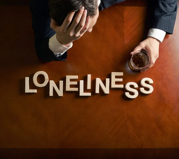 Word Loneliness and devastated man composition