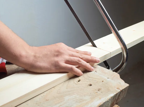 Sawing wooden board