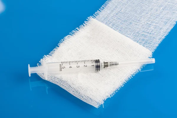 Hypodermic needle and bandage