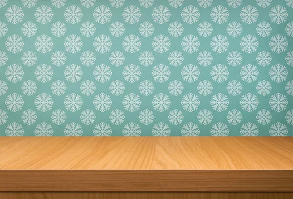 Empty wooden table over vintage wallpaper
