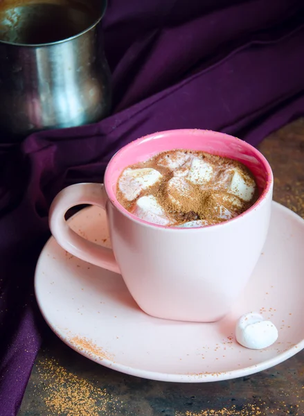 Hot chocolate with marshmallows in pink cup