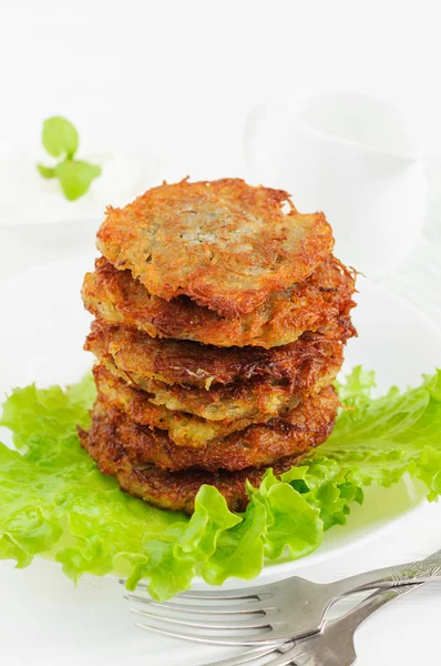 Potato pancakes with salad leaves