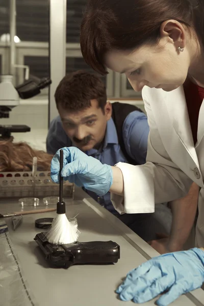 Criminology technician working on fingerprints