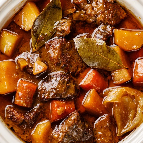 Beef meat stewed with potatoes, carrots and spices