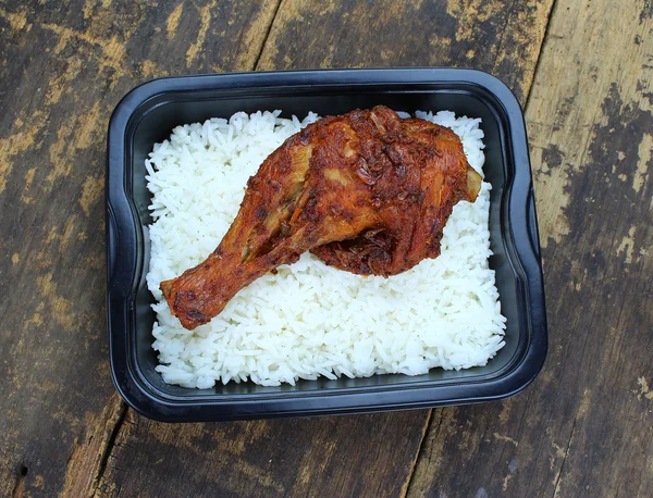 Rice and fried chicken in a box