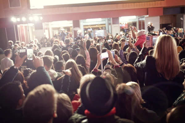 Fans taking photographs