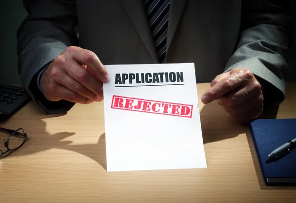 Businessman showing application has been rejected