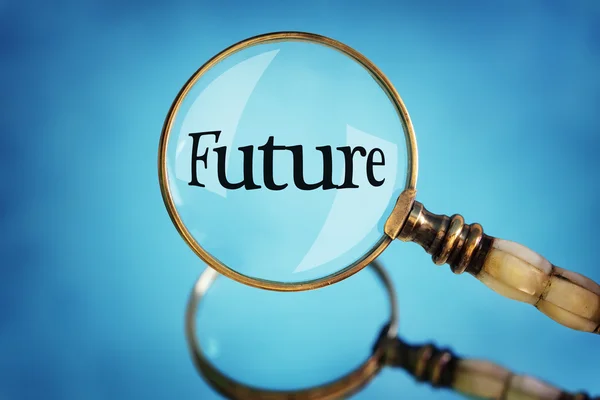 Magnifying glass focus on the word future