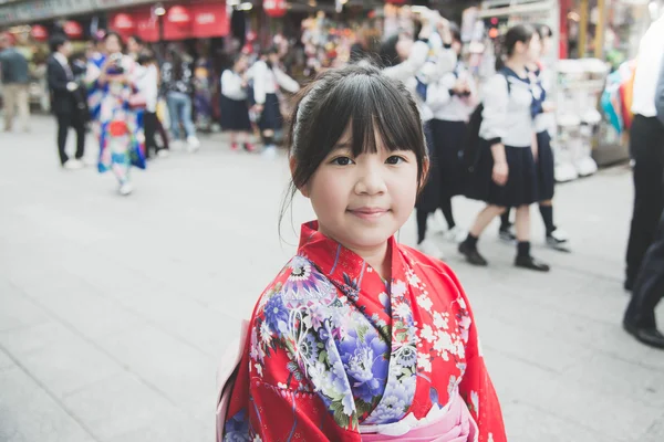 Asian girl wearing red kimono