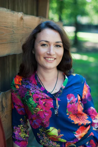 Attractive smiling woman on green background