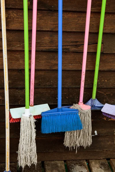 Cleaning equipment on wooden wall