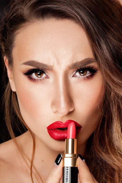 Professional Lips Make-up. Beauty Girl Applying Lipstick