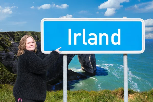 Woman shows the direction to Ireland