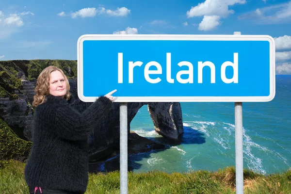 Woman shows the direction to Ireland