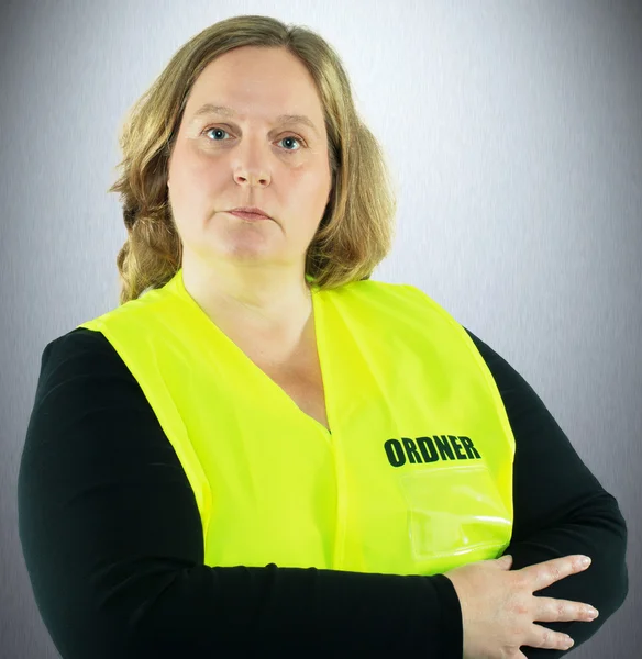 Security Woman isolated in a yellow folder vest