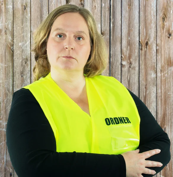 Security Woman isolated in a yellow folder vest