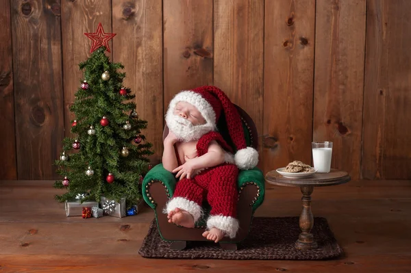 Newborn Baby Boy Wearing a Santa Suit with Beard