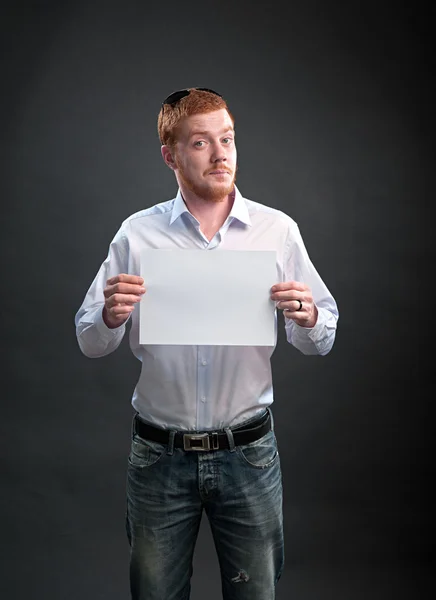 Funny man with a sheet of paper in his hands