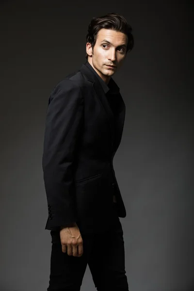 Attractive man in black suit