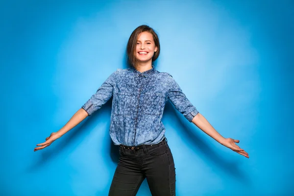 Young woman casual dressed on blue background
