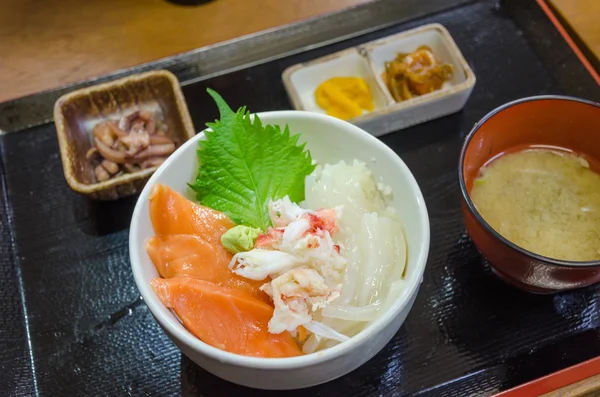 Fresh raw-seafood with salmon, tuna, and squid on rice (Kaisen Don).