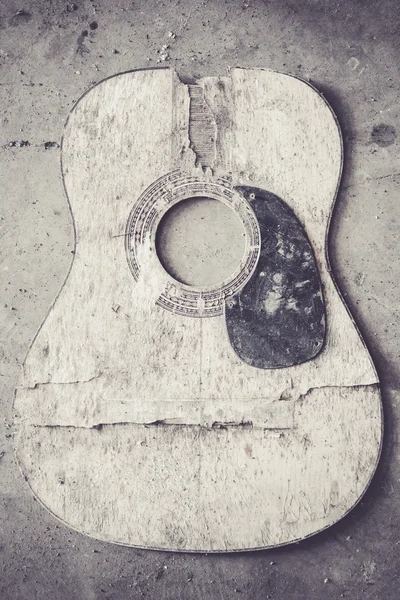 Broken acoustic guitar