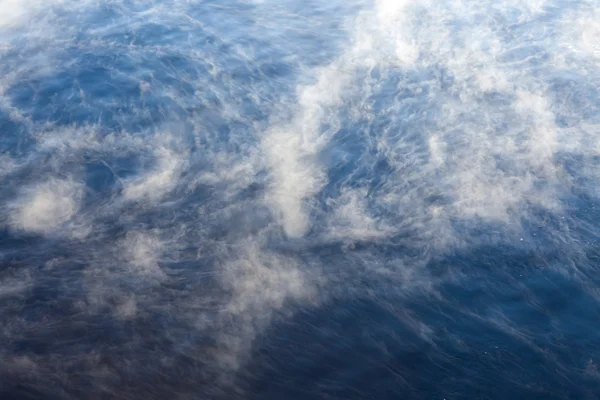 Water vapor on surface of cold water