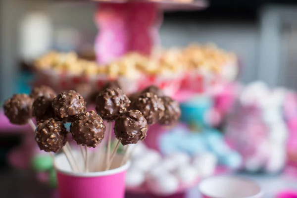 Tasty cakepops on holiday dessert table at kid birthday party