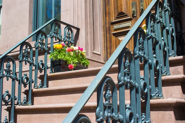 Old houses with stairs in the historic district of West Village
