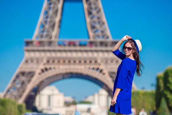 Beautiful woman background the Eiffel tower in Paris, France