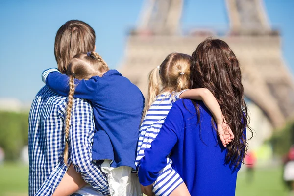 Happy family with two kids in Paris near Eiffel tower