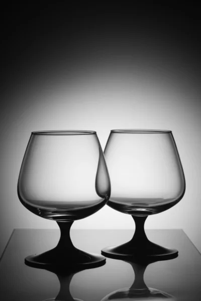 Empty glasses in white light