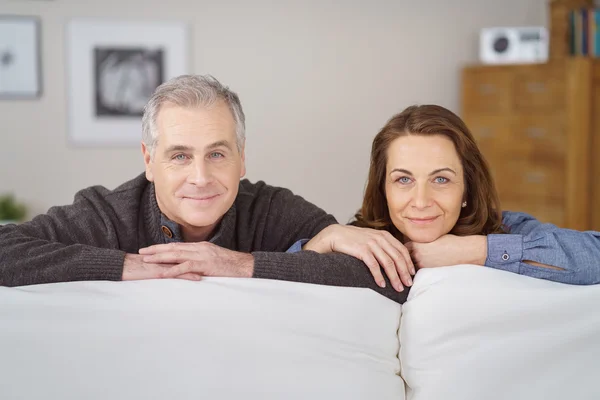 Attractive middle-aged couple with linked arms