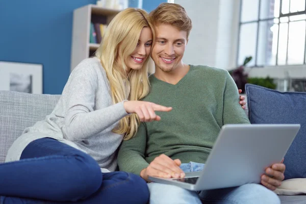 Loving young couple surfing the internet