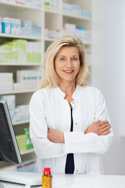 Confident friendly female pharmacist