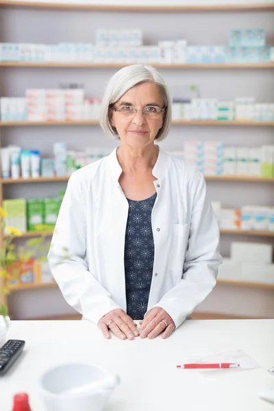 Senior female pharmacist in her pharmacy